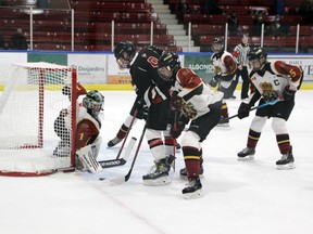 Douro Dukes goalie Charlie Bailey keeps his eye on the puck and protects the side of the net as Jack Armstrong of the Valley Storm tries to get his team on the board during the U15 C division semifinal in the Pembroke Regional Silver Stick Nov. 28 at the Pembroke Memorial Centre. The Dukes won 3-0 to advance to the final. Tina Peplinskie