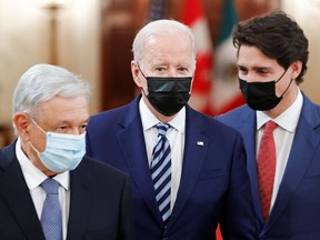 U.S. President Joe Biden, centre, Canada's Prime Minister Justin Trudeau, right, and Mexico's President Andres Manuel Lopez Obrador meet for the North American Leaders' Summit at the White House in Washington, D.C., on Thursday.