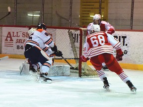 Photo by KEVIN McSHEFFREY/THE STANDARD
Elliot Lake Red Wing Alex Antoine (behind the net) scored the team’s third goal on a power play on the way to the team’s 6-2 victory over the Sault Thunderbirds Sunday afternoon at the Centennial Arena.