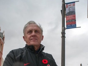 John Kastner, general manager of the Stratford Perth Museum, next to the Remembrance Day banner recognizing his father, Howard Kastner last fall.  (Chris Montanini/Beacon herald file photo)