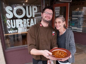 Derek Denny and Ashley Stewart, the owners of Soup Surreal, hold a bowl of stone soup outside their location on Wellington Street. Denny is one of many local chefs who will share the recipe during the House of Blessing's Empty Bowls event on Friday. Chris Montanini/Postmedia News/Stratford Beacon Herald