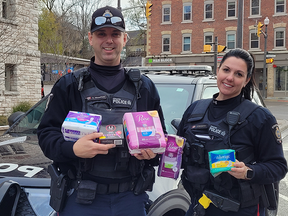 Stratford Police Service Const. Aaron Mounfield and Jennifer Benjamin encourage St. Marys to help them stuff their cruiser full of feminine hygiene products at Foodland Nov. 30 as part of Giving Tuesday.