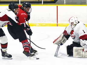 Carter Lewis (7) of the Mitchell Hawks is thwarted on this glorious scoring opportunity against the visiting Walkerton Hawks Nov. 20 in PJHL hockey action in Mitchell. Lewis did collect four assists in a 6-2 victory.