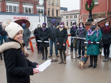 Emily McLean, a sexual abuse psychotherapist at Stratford General Hospital and a member of the Stop Violence Against Women co-ordinating committee of Perth County, addresses a group of volutneers and supporters on Thursday in recognition of the International Day for the Elimination of Violence Against Women. Chris Montanini/Stratford Beacon Herald/Postmedia News