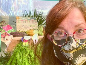 Kathleen Brosemer poses in front of a display at the Indigenous Peoples' Pavilion. PHOTO SUPPLIED