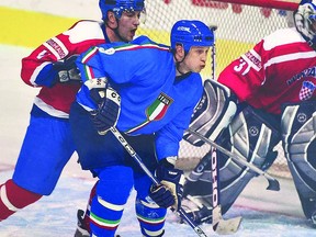 Sault boys John Glavota (left) of the Croatian National Team and John Parco (right) of the Italian National Team compete against each other in international hockey play from more than a dozen years ago.