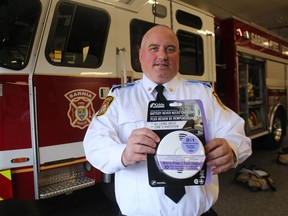 Deputy Fire Chief Ken Dwinnell holds one of 282 combination smoke and carbon monoxide detectors donated recently to Sarnia Fire Rescue Services from Safe Community Project Zero.
