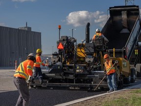 Asphalt, including an additive made from recycled plastic, is installed at a new Nova Chemicals manufacturing facility being built on Rokeby Line in St. Clair Township.