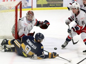 Luigi Benincasa tries to make a play on the puck from his backside during the Spruce Grove Saints 5-4 shootout win over the Brooks Bandits on Saturday at the Grant Fuhr Arena in Spruce Grove.