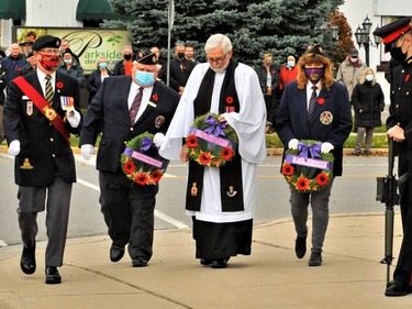 Members of the Royal Canadian Legion in Simcoe and the Army, Navy and Air Force, Unit 255, also of Simcoe, placed wreaths at the Norfolk War Memorial Thursday morning as part of the town's annual Remembrance Day observance. From left are Chris Davis, sergeant-at-arms at the Simcoe Legion, Bruce Wilson, president of AN&AF Unit 255, Rev. Bryan Robertson, president of the Simcoe Legion, and Donna Hebert, president of the Ladies Auxiliary of AN&AF Unit 255. Serving as sentries for Thursday's program were members of the 69th Battery of the 56th Field Regiment of the Royal Canadian Artillery, which is based at the Simcoe Armouries. -- Monte Sonnenberg
