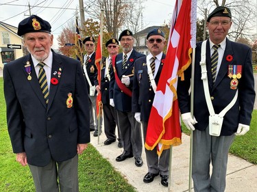 Kenneth Churches, left, of Port Dover, saw service in the Royal Navy in Great Britain in the years following the Second World War. He gathered with members of the colour party from the Royal Canadian Legion in Port Dover Thursday morning en route to the town's cenotaph on Main Street for the community's annual Remembrance Day observance. Members of the colour party include, from left, Michael Ryan, Darcy Mitchell, Ken Mackay, Jim Pilkington and Chris Tietz. -- Monte Sonnenberg