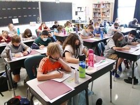 Grade 5 students take part in a class lesson at MacLeod Public School in Sudbury, Ont., during the first day back to school on Tuesday September 7, 2021. John Lappa/Sudbury Star/Postmedia Network