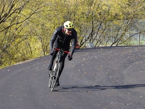 Mike Loken, of the Rolling Circus cyclists from Sessions Ride Co., flies around the newly resurfaced track at Delki Dozzi Memorial Park in Sudbury, Ont. Tuesday will be a good day for a ride, with sunny skies expected a high 6 degrees C. John Lappa/Sudbury Star/Postmedia Network
