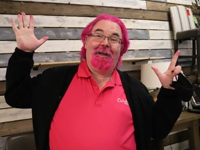 Paul McQueen, president and general manager of Ashley Homestore, shows off his dyed hair at the Barrydowne store in Sudbury, Ont. on Friday November 5, 2021. McQueen dyed his hair pink after his staff exceeded a fund-raising challenge. More than $17,000 was raised from a portion of store sales, staff and customers, for the Northern Cancer Foundation. John Lappa/Sudbury Star/Postmedia Network