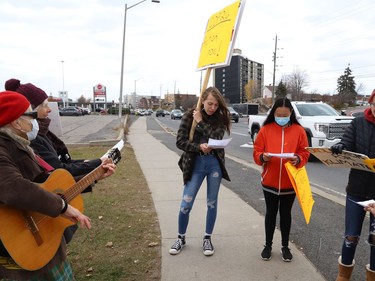 Participants take part in a Fridays For Future rally in Sudbury, Ont. on Friday November 5, 2021 to mark the COP26 climate summit in Scotland. Local climate activist Sophia Mathur spoke to local rally participants via cell phone from Scotland, where she is attending the climate summit. John Lappa/Sudbury Star/Postmedia Network