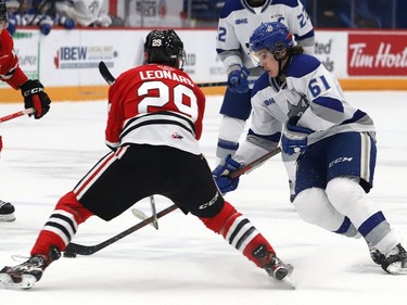 Chase Stillman, right, of the Sudbury Wolves, attempts to elude Alec Leonard, of the Niagara IceDogs, during OHL action at the Sudbury Community Arena in Sudbury, Ont. on Friday November 5, 2021. John Lappa/Sudbury Star/Postmedia Network