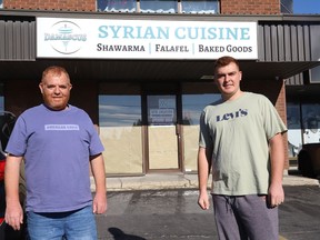 Hussein Qarqouz, left, and his son, Mohammad, stand in front of their restaurant, Damascus Syrian Cuisine, located in New Sudbury at Place de Leon mall on Lasalle Boulevard. John Lappa/Sudbury Star/Postmedia Network