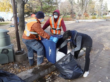 Workers from Reliable Cleaning Services remove debris from Memorial Park in Sudbury, Ont. on Wednesday November 10, 2021. A cleanup was undertaken Wednesday at Memorial Park in anticipation of Remembrance Day visitation on Thursday. See story on page A6. John Lappa/Sudbury Star/Postmedia Network