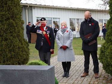 Sergeant-at-Arms Fred Medynski escorts Sudbury MP Viviane Lapointe and Sudbury MPP Jamie West to the cenotaph at a Remembrance Day service at Branch 76 of the Royal Canadian Legion in Sudbury, Ont. on Thursday November 11, 2021. John Lappa/Sudbury Star/Postmedia Network