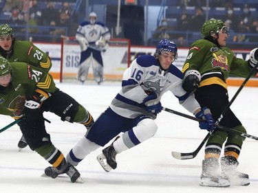 Nick DeGrazia, middle, of the Sudbury Wolves, collides with Ty Nelson, left, and Paul Christopoulos, of the North Bay Battalion, during OHL action at the Sudbury Community Arena in Sudbury, Ont. on Friday November 12, 2021. John Lappa/Sudbury Star/Postmedia Network