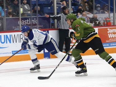 Chase Stillman, left, of the Sudbury Wolves, and Tnias Mathurin, of the North Bay Battalion, race to the puck during OHL action at the Sudbury Community Arena in Sudbury, Ont. on Friday November 12, 2021. John Lappa/Sudbury Star/Postmedia Network