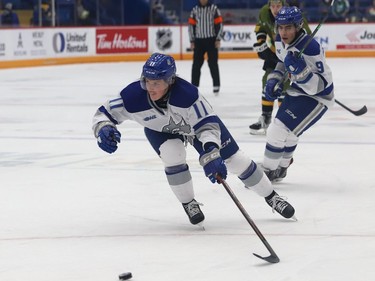 Landon McCallum, of the Sudbury Wolves, reaches for the puck during OHL action against the North Bay Battalion at the Sudbury Community Arena in Sudbury, Ont. on Friday November 12, 2021. John Lappa/Sudbury Star/Postmedia Network