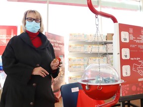 Vicki Gilhula volunteers her time at a kettle as part of the Salvation Army's Christmas Kettle campaign at Chris' Your Independent Grocer in Sudbury, Ont. on Friday November 19, 2021. The campaign is the Salvation Army's biggest fundraiser of the year. John Lappa/Sudbury Star/Postmedia Network