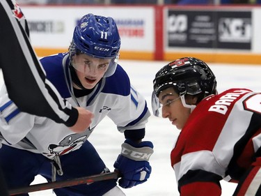Landon McCallum, left, of the Sudbury Wolves, and Chris Barlas, of the Ottawa 67's, take part in a faceoff during OHL action at the Sudbury Community Arena in Sudbury, Ont. on Friday November 19, 2021. John Lappa/Sudbury Star/Postmedia Network