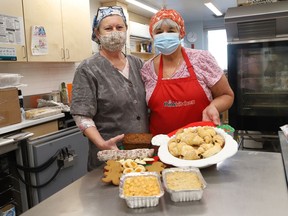Linda Russell, left, and Daria Zelenczuk display goodies that will be available at a pop-up bake sale fundraiser at the Ukrainian Centre at 30 Notre Dame Ave. in Sudbury, Ont. on December 12, 2021, from 11 a.m. to 2 p.m. A curbside pickup hot luncheon will also be held on Dec. 12 from 11 a.m. to 1:30 p.m. The meal includes cabbage rolls, pyrohy and meat sticks for $15. A dozen pyrohy, or a dozen cabbage rolls for $10 each, are also available. Orders must be placed before Dec. 9 by calling 705-673-7404. John Lappa/Sudbury Star/Postmedia Network
