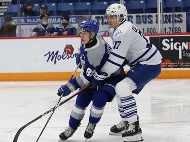 David Goyette, left, of the Sudbury Wolves, and Ethan Del Mastro, of the Mississauga Steelheads, battle for position during OHL action at the Sudbury Community Arena in Sudbury, Ont. on Friday November 26, 2021. John Lappa/Sudbury Star/Postmedia Network