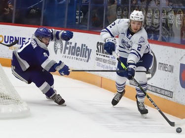 Alex Assadourian, left, of the Sudbury Wolves, chases after Evan Brand, of the Mississauga Steelheads, during OHL action at the Sudbury Community Arena in Sudbury, Ont. on Friday November 26, 2021. John Lappa/Sudbury Star/Postmedia Network