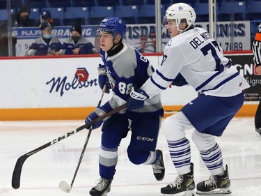 David Goyette, left, of the Sudbury Wolves, and Ethan Del Mastro, of the Mississauga Steelheads, battle for position during OHL action at the Sudbury Community Arena in Sudbury, Ont. on Friday November 26, 2021. John Lappa/Sudbury Star/Postmedia Network