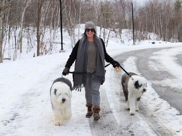 Kara Longarini walks her dogs, Marley and Scooby, at the Delki Dozzi track in Sudbury, Ont. on Monday November 29, 2021. John Lappa/Sudbury Star/Postmedia Network
