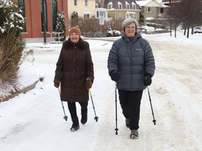 Jane Davey, left, and Carmen Simmons get some exercise while Urban Poling in Sudbury, Ont. on Monday November 29, 2021. John Lappa/Sudbury Star/Postmedia Network