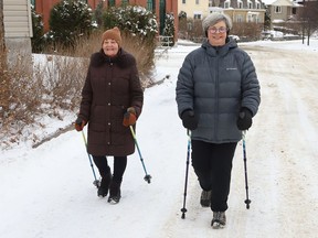 Jane Davey, left, and Carmen Simmons get some exercise while Urban Poling in Sudbury, Ont. on Monday November 29, 2021. John Lappa/Sudbury Star/Postmedia Network