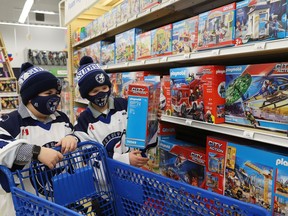 Dallyn Lalonde, 9, left, and Cole Ginson, 9, of the U10 AA Timberwolves, shop for toys in support of Our Children, Our Future's annual Tree of Dreams Toy Drive at Toys R Us in Sudbury, Ont. on Tuesday November 30, 2021.