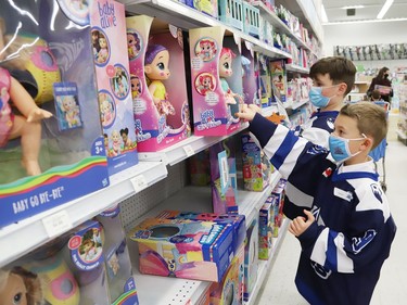 Brock Lafortune, 9, back, and Dexton Cardinal, 7, shop for toys in support of Our Children, Our Future's annual Tree of Dreams Toy Drive at Toys R Us in Sudbury, Ont. on Tuesday November 30, 2021. Victim Services sponsored the event in partnership with the Sudbury Minor Hockey Association's U9 Nickel Kings and the U10 AA Timberwolves. The players selected names from the Tree of Dreams and then selected toys for the children. John Lappa/Sudbury Star/Postmedia Network