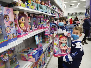 Brock Lafortune, 9, back, and Dexton Cardinal, 7, shop for toys in support of Our Children, Our Future's annual Tree of Dreams Toy Drive at Toys R Us in Sudbury, Ont. on Tuesday November 30, 2021. Victim Services sponsored the event in partnership with the Sudbury Minor Hockey Association's U9 Nickel Kings and the U10 AA Timberwolves. The players selected names from the Tree of Dreams and then selected toys for the children. John Lappa/Sudbury Star/Postmedia Network