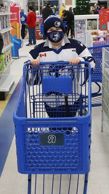 Dallyn Lalonde, 9, of the U10 AA Timberwolves, was ready to shop for toys to support Our Children, Our Future's annual Tree of Dreams Toy Drive at Toys R Us in Sudbury, Ont. on Tuesday November 30, 2021. Victim Services sponsored the event in partnership with the Sudbury Minor Hockey Association's U9 Nickel Kings and the U10 AA Timberwolves. The players selected names from the Tree of Dreams and then selected toys for the children. John Lappa/Sudbury Star/Postmedia Network