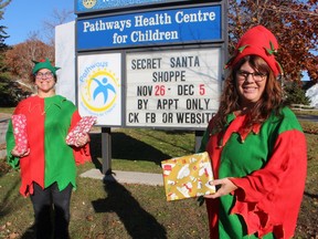 Marcy Draker (left) and Julie Ingles, with Pathways Health Centre for Children, get in the Christmas spirit to help promote this year's upcoming Secret Santa Shoppe fundraiser at the Sarnia centre. Paul Morden/Postmedia