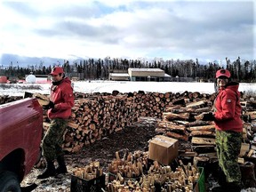 Canadian Rangers Eli Owen and Nadine Strang cut wood for elders who remained in Neskantaga  when most of the First Nation community evacuated during a drinking water supply crisis.

Supplied