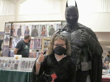 Batman poses with a youngster attending the Timmins Mini Con on Saturday.

ANDREW AUTIO/The Daily Press
