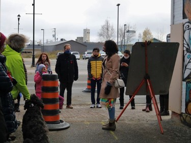 Just off Spruce Street South, Tmmins Coun. Kristin Murray addresses the group taking part in the tour, including Timmins Mayor George Pirie.

ANDREW AUTIO/The Daily Press