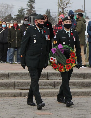 Warrant Officer Michael Tourangeau, left, and Master Cpl. Gallagher place a wreath at the cenotaph in Hollinger Park on behalf of the Algonquin Regiment during the Remembrance Day ceremony held in Timmins Thursday morning.

RON GRECH/The Daily Press