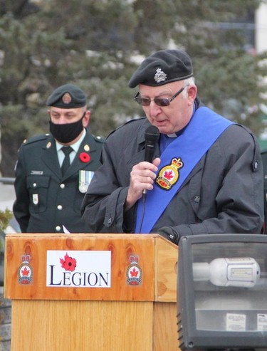 Jake Gregorcic, deacon for the Royal Canadian Legion Branch 88, reads John McCrae's poem "In Flanders Fields" during the Remembrance Day ceremony held in Timmins Thursday morning.

RON GRECH/The Daily Press