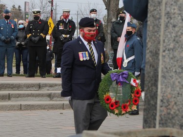 Anthony Villeneuve, a member of the Royal Canadian Legion Branch 88, places a wreath at the cenotaph in Hollinger Park during Thursday morning's Remembrance Day ceremony.

RON GRECH/The Daily Press