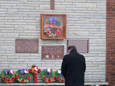 Timmins Mayor George Pirie places a wreath on behalf of the City of Timmins on the cenotaph at the Royal Canadian Legion Branch 287 in South Porcupine Thursday morning.

ANDREW AUTIO/The Daily Press