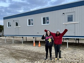 Students Kylea Naveau and Tamiika Naveau came by to see the new classroom going up.

Supplied photo
