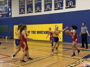 Kailyn Kellam, of the BCI Mustangs defends against Faiqa Anjum, of the Paris Panthers in senior girls' quarter final action on Monday