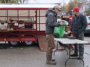 Saturday, the final day of the 2021 season, was a busy day at the Tillsonburg Farmers Market for Greg Boyd (right) of Heritage Lane Produce. (Chris Abbott/Norfolk and Tillsonburg News)